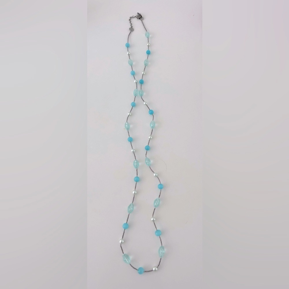 Sterling long necklace with Swarovski stones in jewelry pouch.